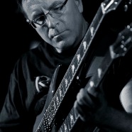 Brad playing double-neck (B&W) (4)